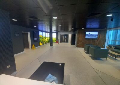 reception area with sofas and screen