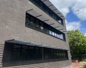 side of new college building showing three rows of windows