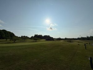 sun shining on golf course