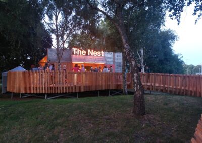 new theatre building with name in lights and people outside