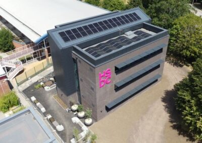 view from above of new college building surrounded by hedges