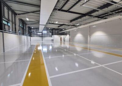 interior room of new college building with white lines on floor