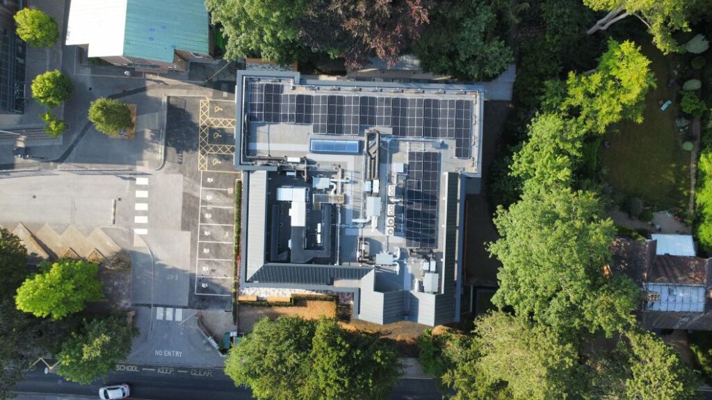aerial view of new college building showing roof with solar panels