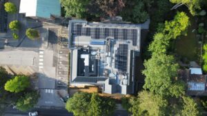 aerial view of new college building showing roof with solar panels