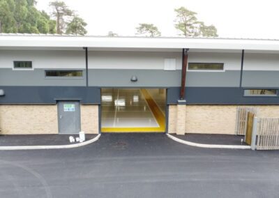 new college building with open bay doors entrance