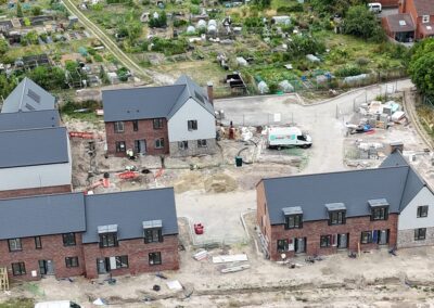 new houses being built with allotment in the background
